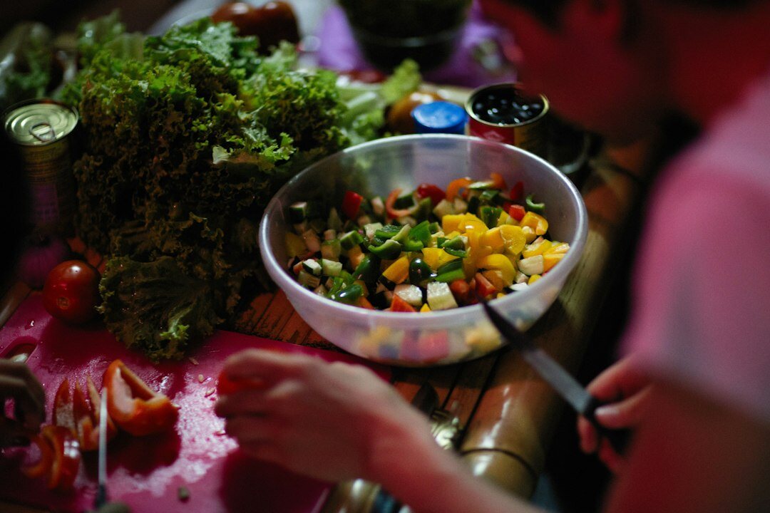 woman preparing fresh salad