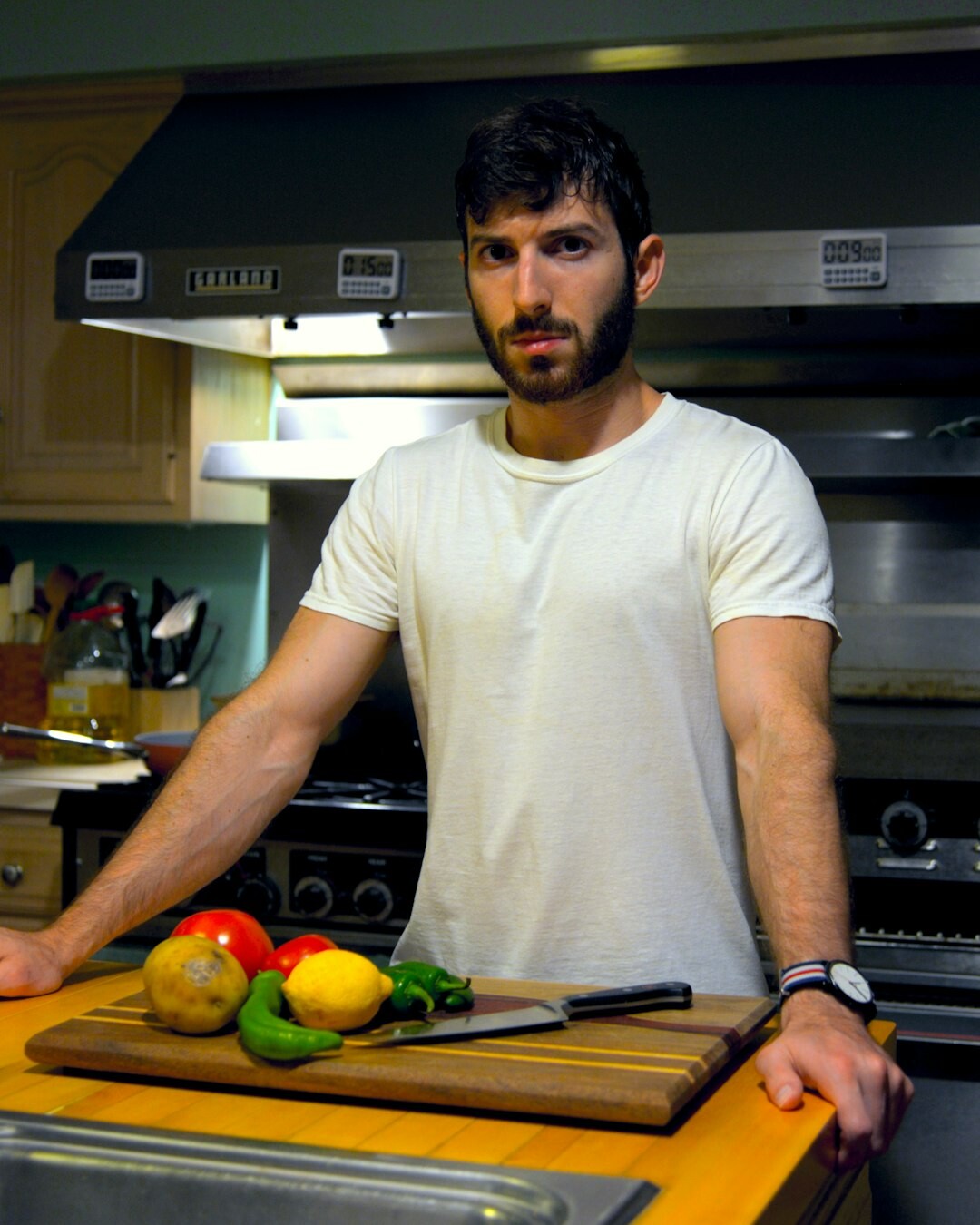 Portrait of a Czech man in his sixties, cookbook author, in a kitchen