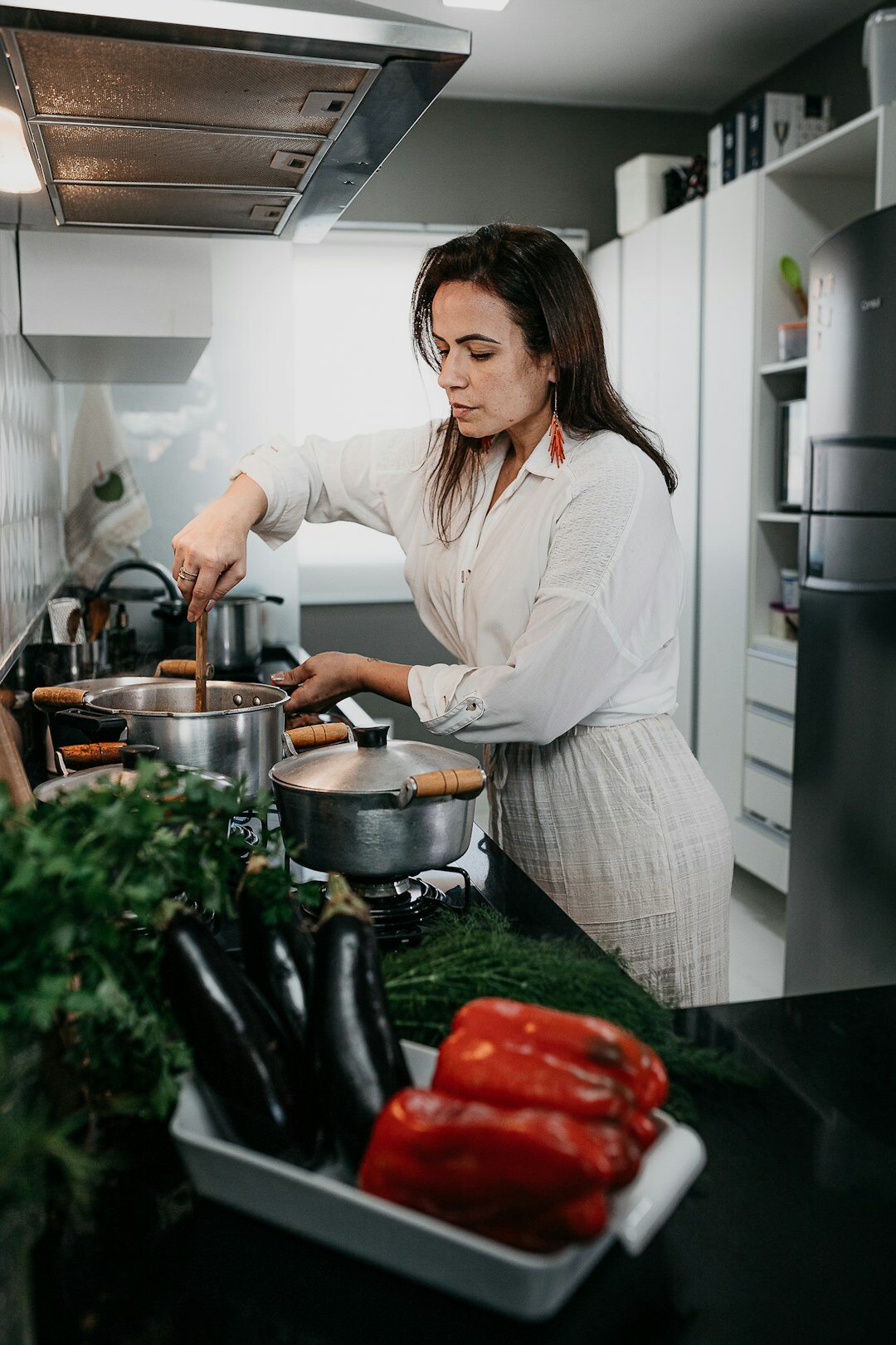 woman chopping vegetables in kitchen