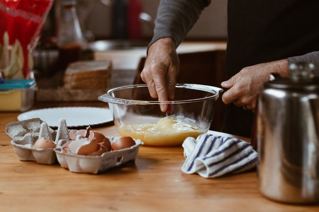 person preparing ingredients on counter