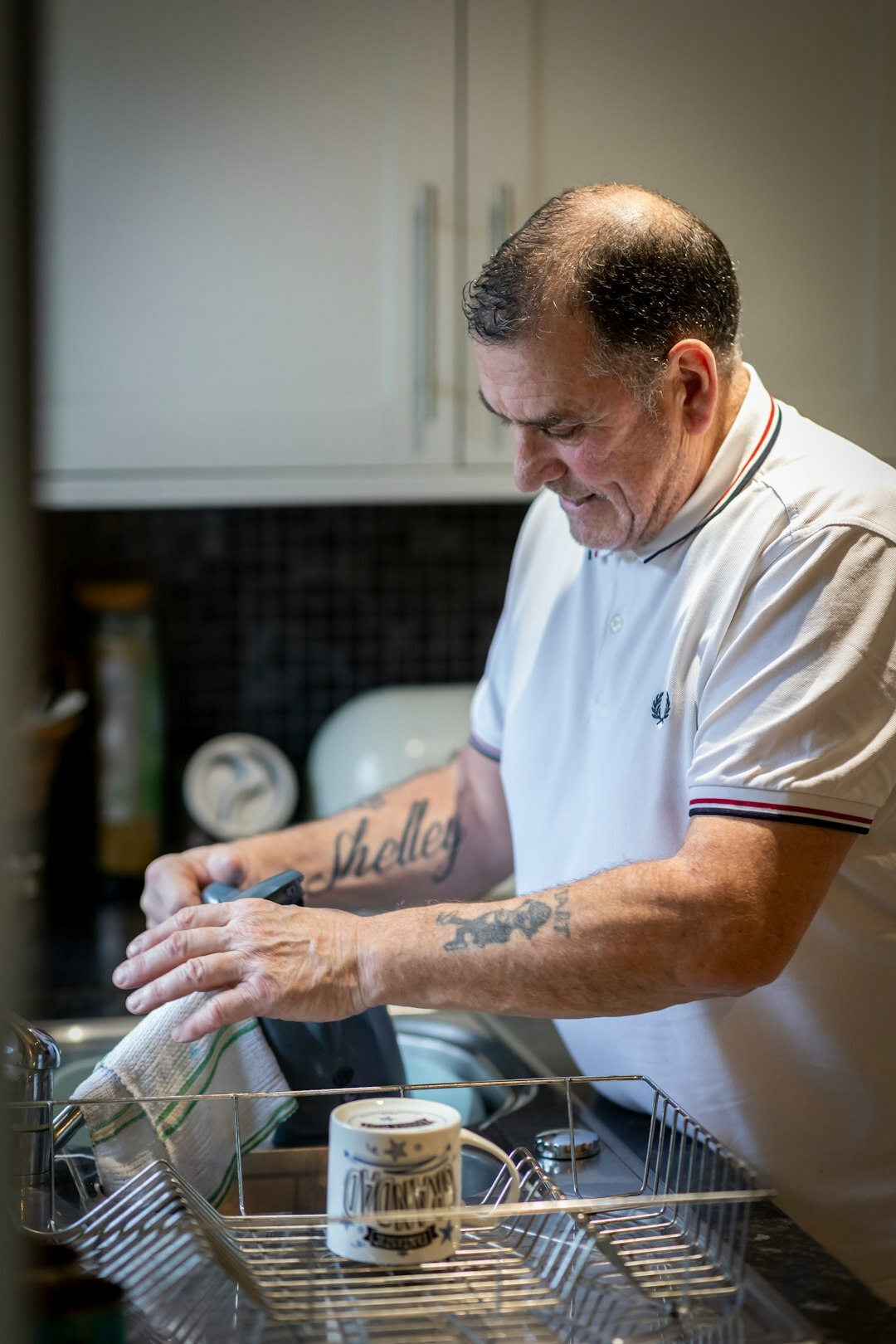 Portrait of a Czech man in his seventies, traditional cuisine expert, at home