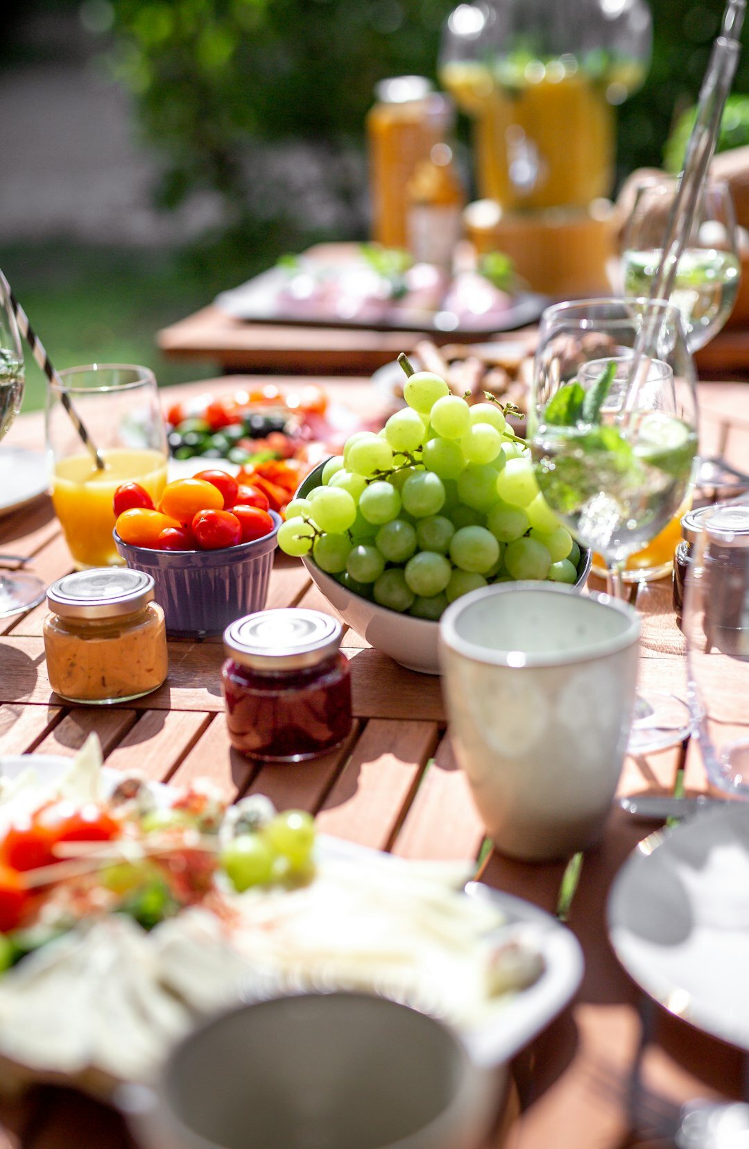 Grilled vegetables and fresh salad on a garden table in summer